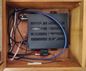 Amplifier, hidden in a cupboard